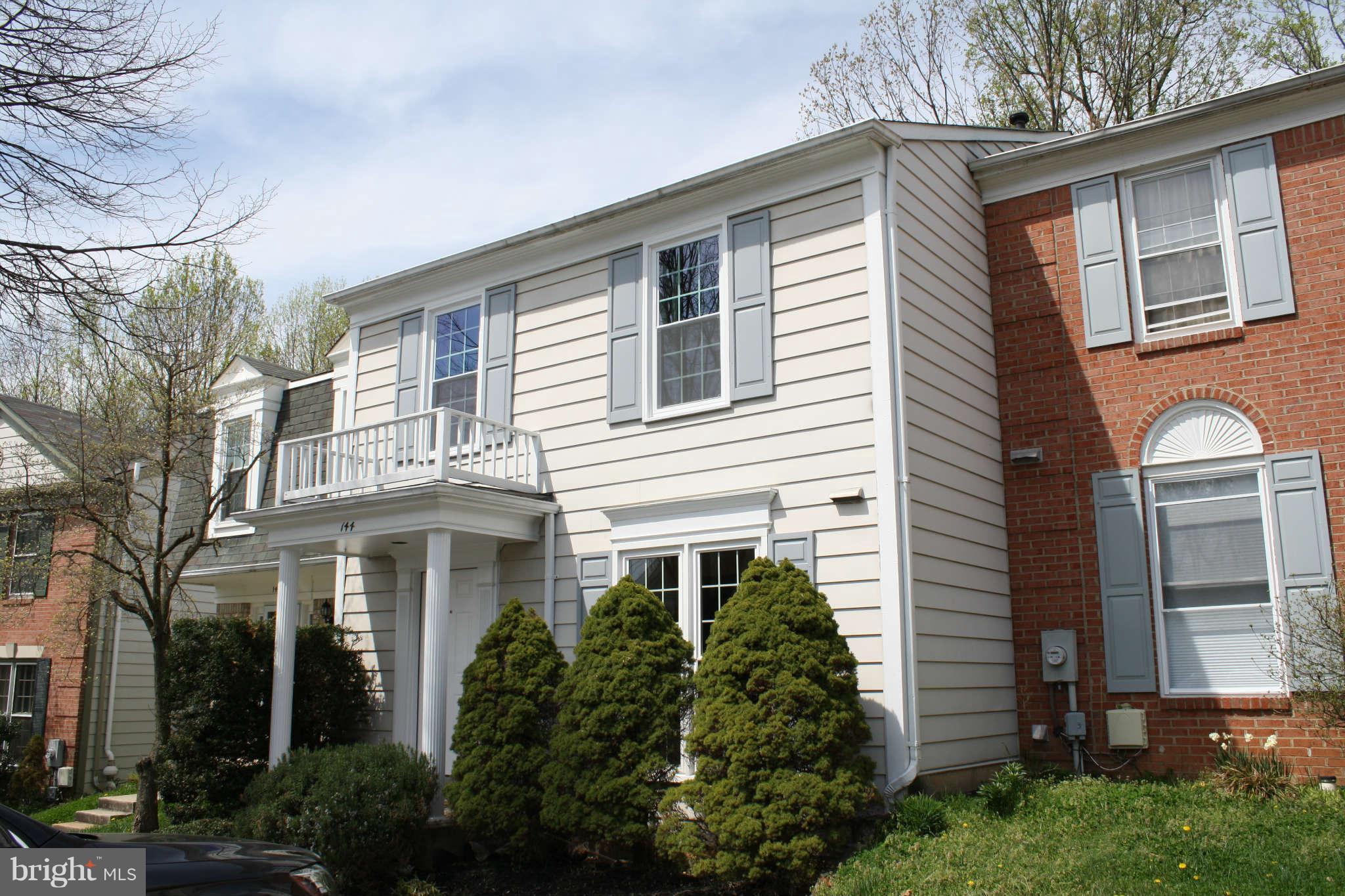 144 Finale Terrace Silver Spring, MD 20901 - Photo 1 of 21 a front view of a house with a garden