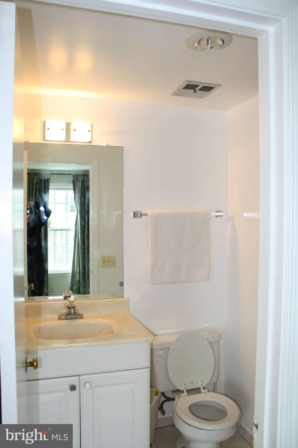 144 Finale Terrace Silver Spring, MD 20901 - Photo 12 of 21 a bathroom with a sink toilet and mirror