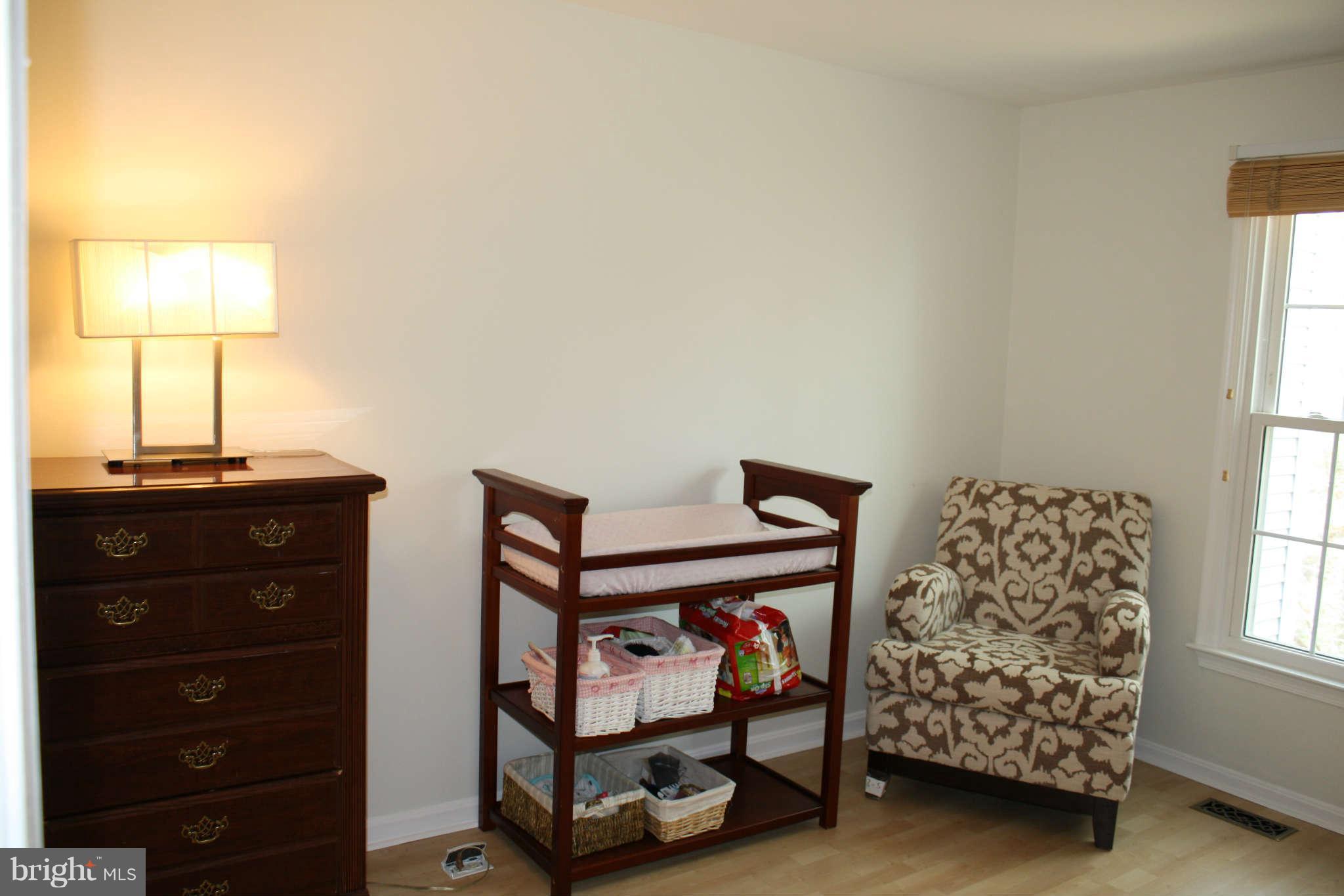 144 Finale Terrace Silver Spring, MD 20901 - Photo 13 of 21 a bedroom with a bed and a window