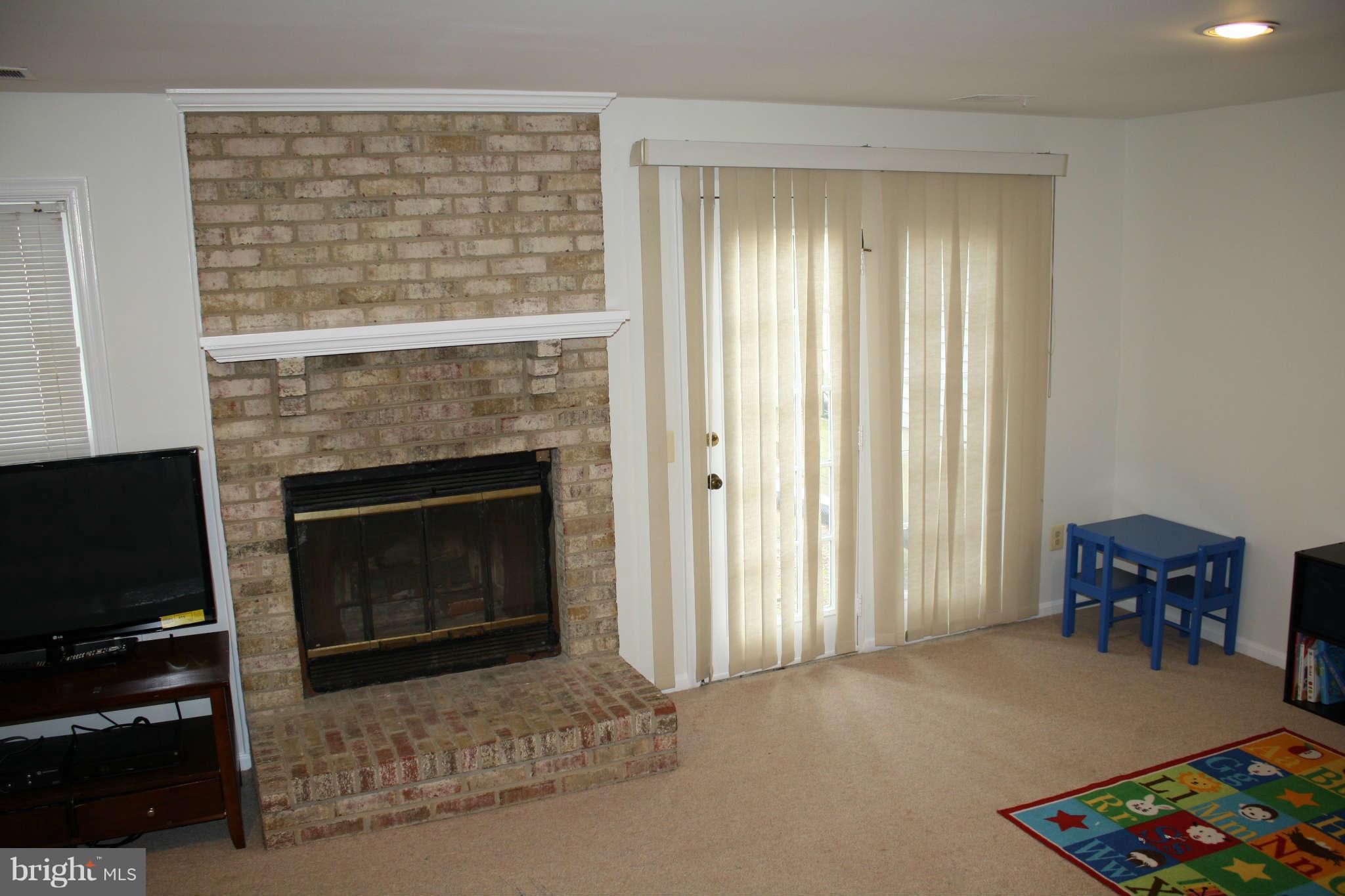 144 Finale Terrace Silver Spring, MD 20901 - Photo 16 of 21 a living room with furniture and a fireplace