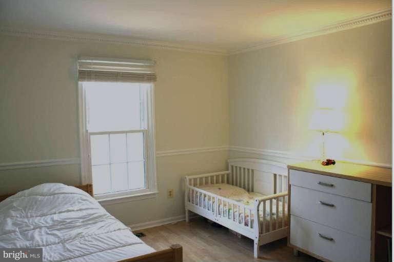 144 Finale Terrace Silver Spring, MD 20901 - Photo 10 of 21 a bedroom with a bed and a window