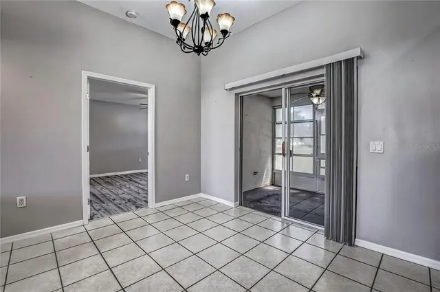 a view of room with hardwood floor and ceiling fan