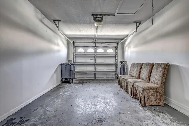 a view of a house with pool and a yard