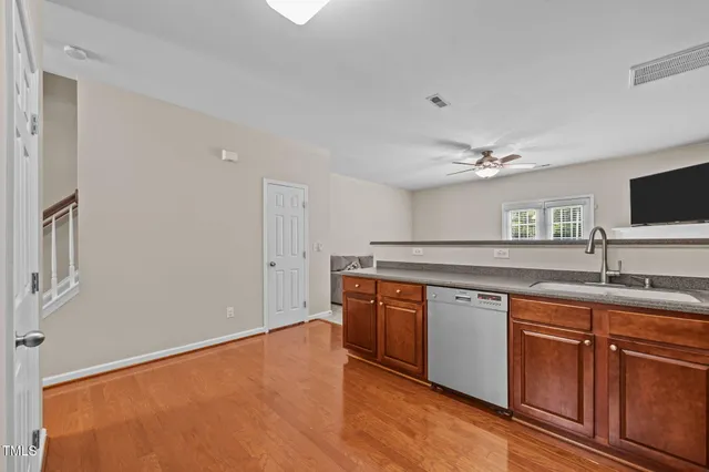 a spacious bathroom with a granite countertop sink and a mirror