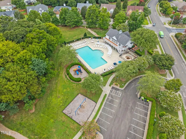 an aerial view of a house with garden space and street view