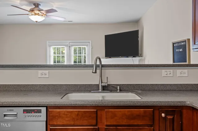 a kitchen with a sink and a microwave