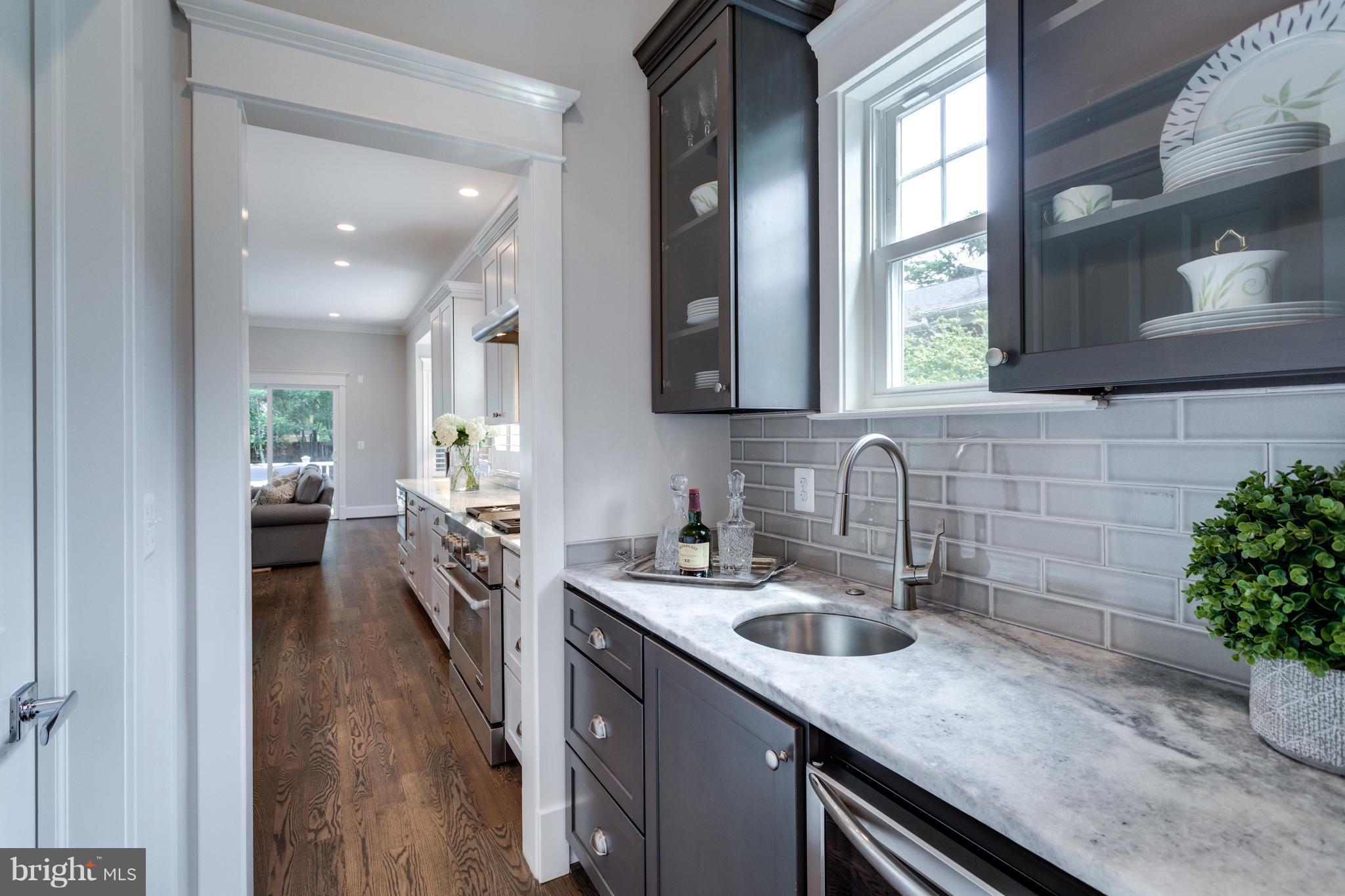 8115 Wellington Road Alexandria, VA 22308 - Photo 10 of 30 Wet bar and pantry between kitchen and dining