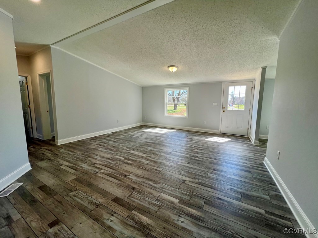409 Remo Road Heathsville, VA 22473 - Photo 11 of 25 an empty room with wooden floor and windows