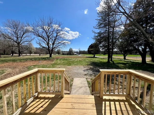 a view of a yard with wooden stairs