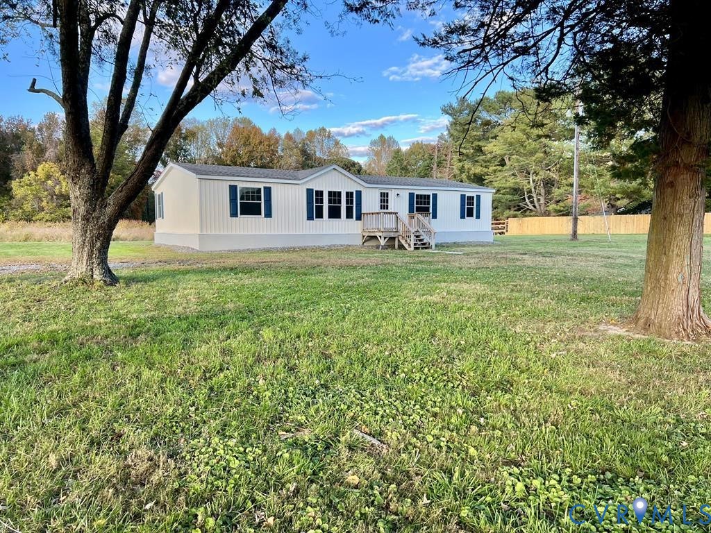 409 Remo Road Heathsville, VA 22473 - Photo 22 of 25 a view of a yard in front of a house with large trees