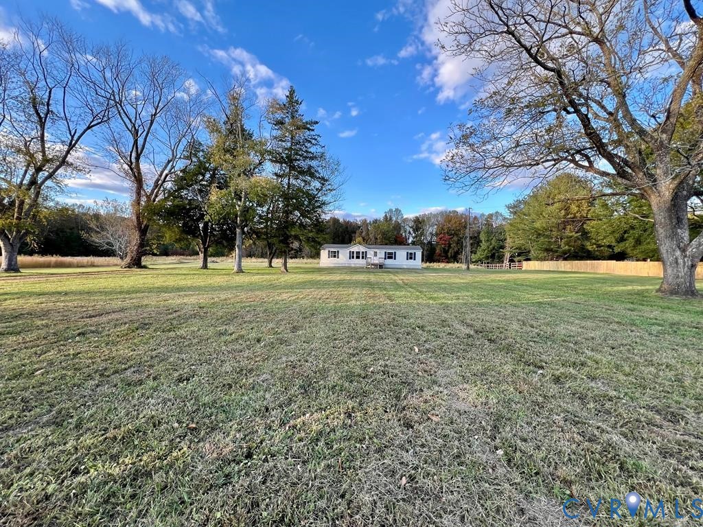 409 Remo Road Heathsville, VA 22473 - Photo 24 of 25 a view of a grassy field with trees