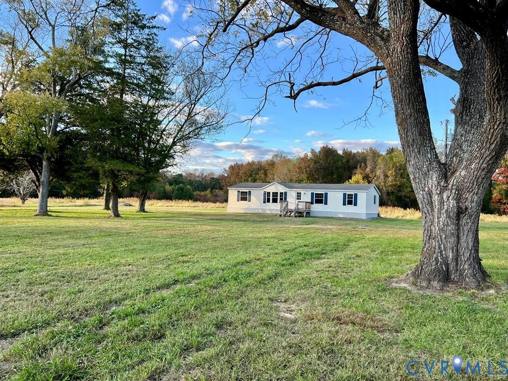 409 Remo Road Heathsville, VA 22473 - Photo 25 of 25 a view of a house with a big yard