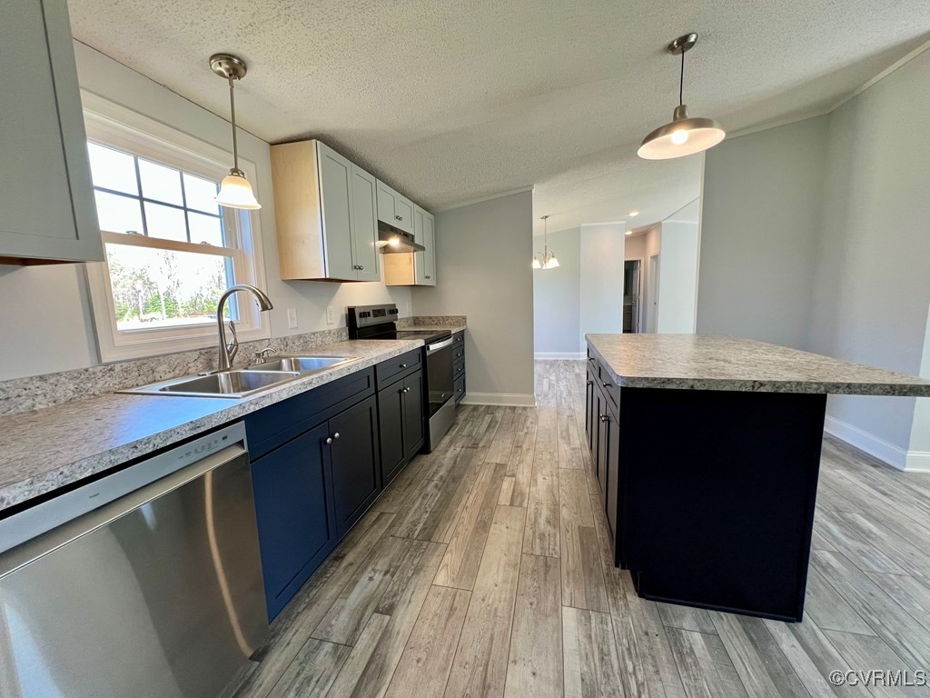 409 Remo Road Heathsville, VA 22473 - Photo 6 of 25 a large kitchen with granite countertop a sink dishwasher a stove and a refrigerator
