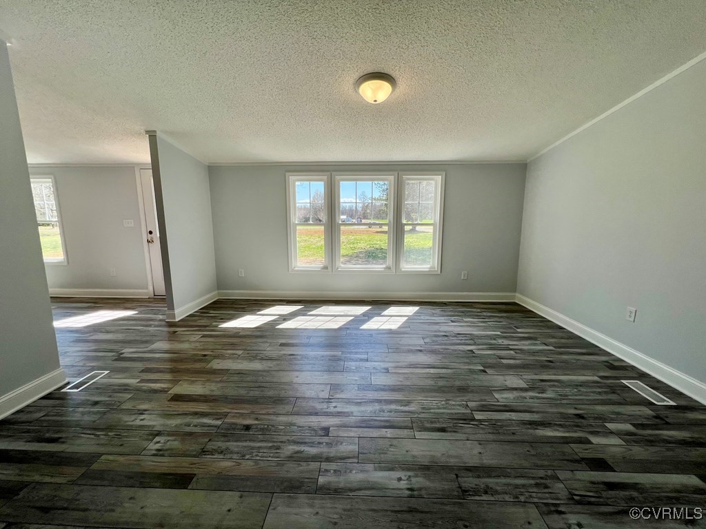 409 Remo Road Heathsville, VA 22473 - Photo 10 of 25 an empty room with wooden floor and windows