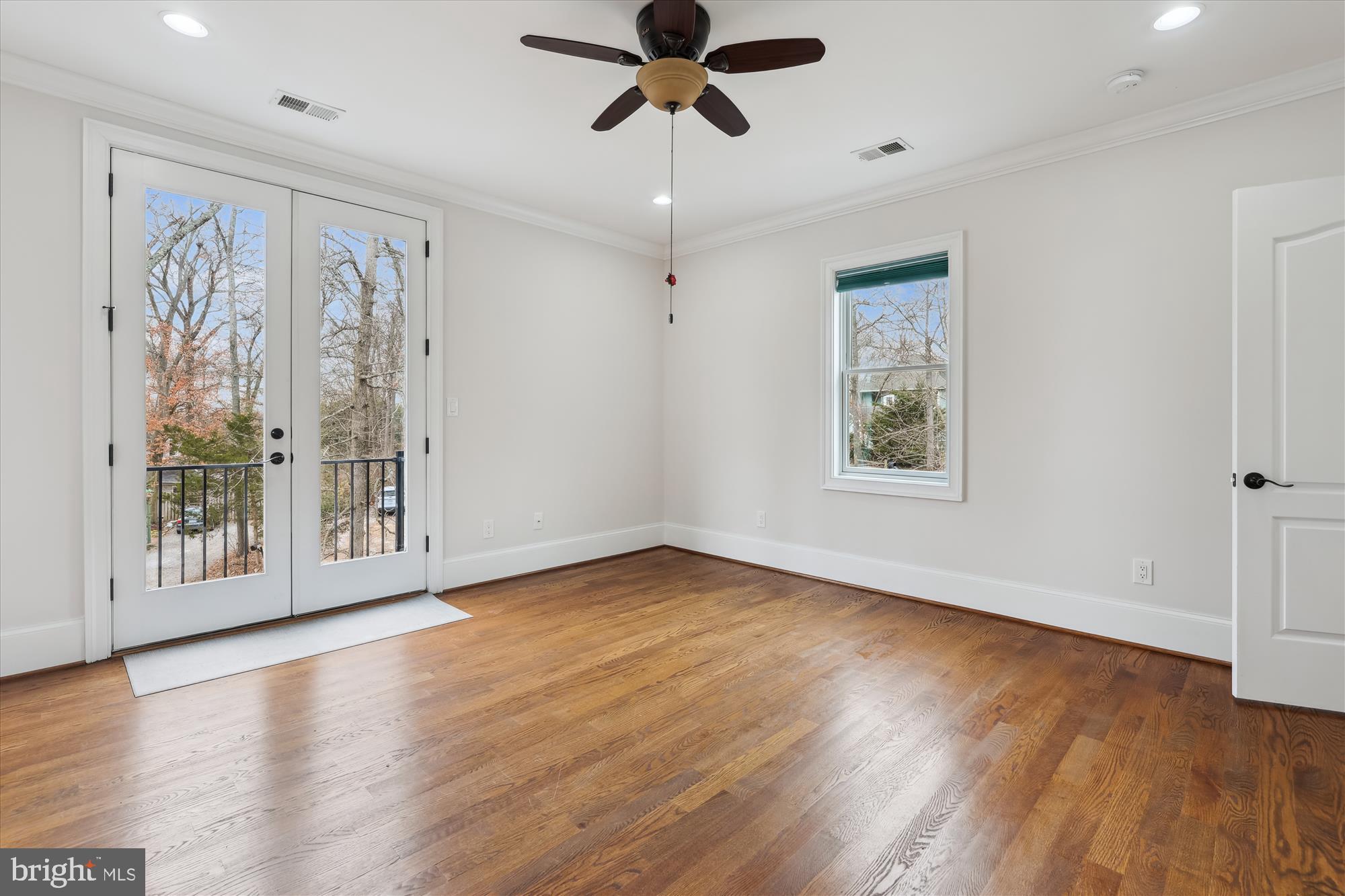 1217 Shenandoah Road Alexandria, VA 22308 - Photo 27 of 43 a view of an empty room with wooden floor and a window