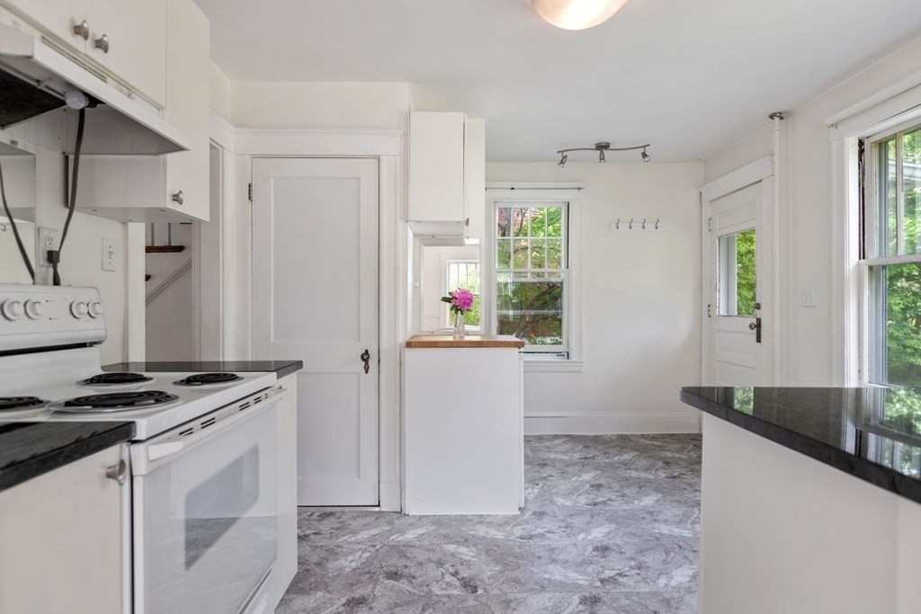 264 Lincoln Road Lincoln, MA 01773 - Photo 14 of 31 a kitchen with a stove a sink and a refrigerator