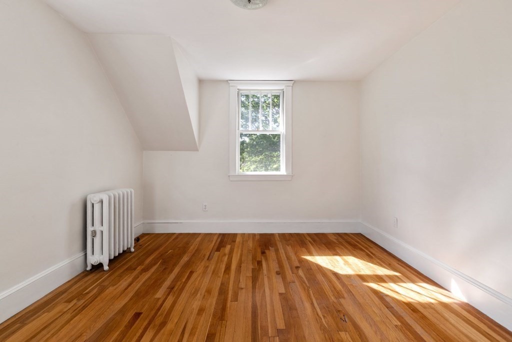 264 Lincoln Road Lincoln, MA 01773 - Photo 19 of 31 a view of empty room with wooden floor and fan