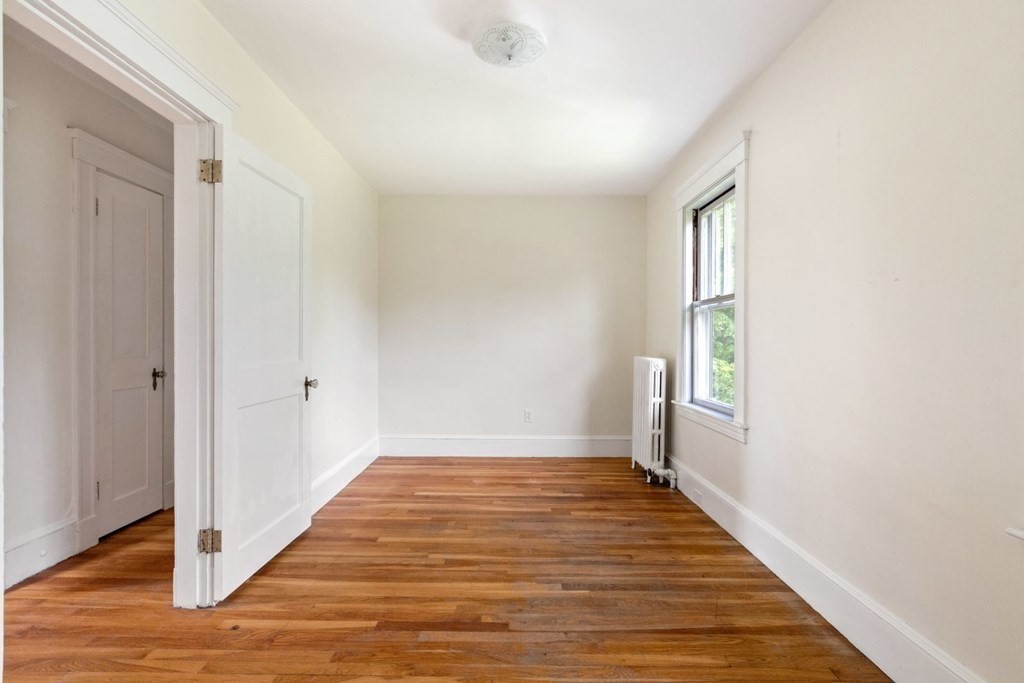 264 Lincoln Road Lincoln, MA 01773 - Photo 20 of 31 a view of an empty room with wooden floor and a window