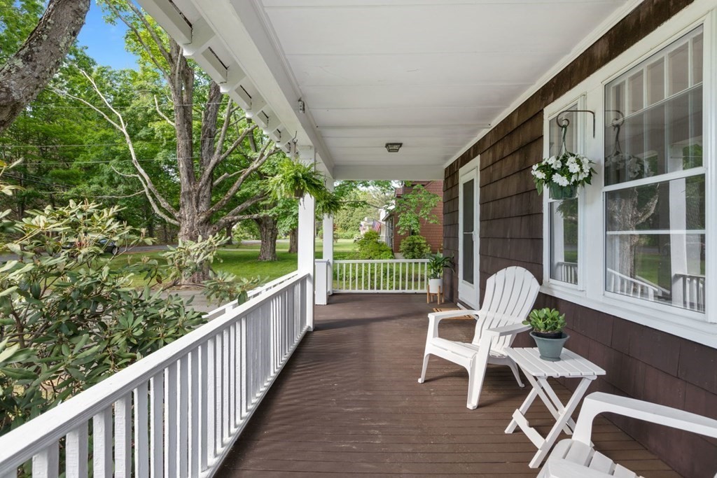 264 Lincoln Road Lincoln, MA 01773 - Photo 2 of 31 a view of a chair and tables in the balcony