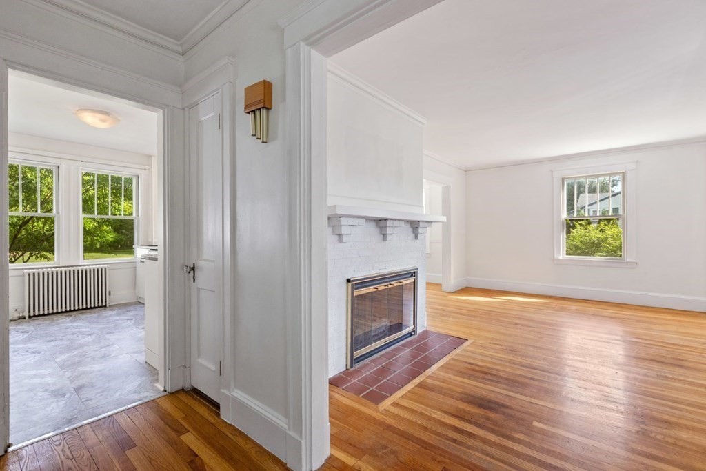 264 Lincoln Road Lincoln, MA 01773 - Photo 8 of 31 a view of livingroom with hardwood floor and a fireplace