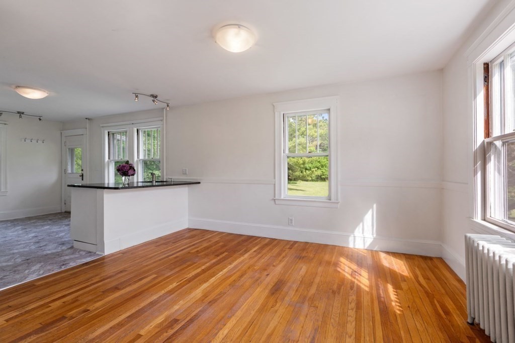 264 Lincoln Road Lincoln, MA 01773 - Photo 10 of 31 wooden floor in an empty room with a window