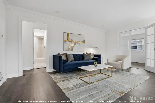 a living room with couches and a potted plant on table with wooden floor