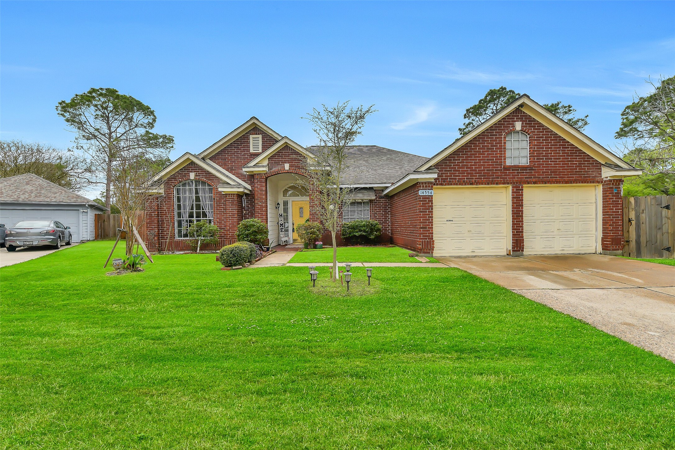 a front view of a house with garden