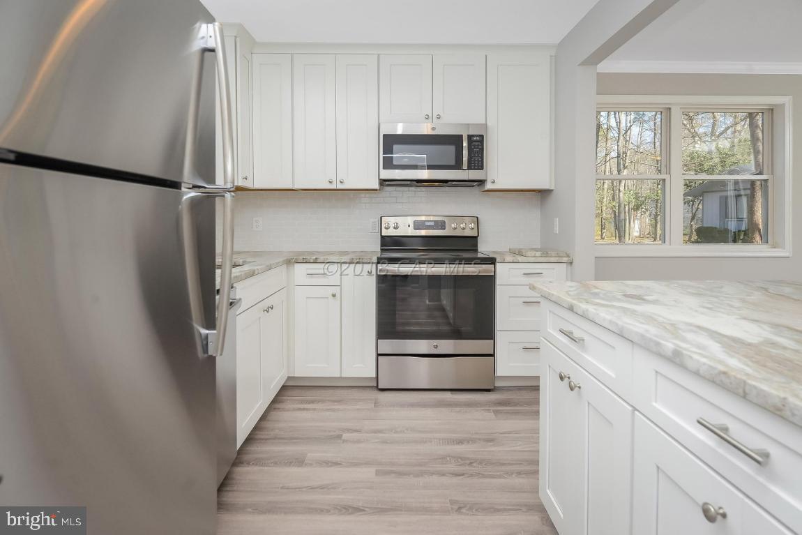 45 Abbyshire Road Ocean Pines, MD 21811 - Photo 11 of 37 a kitchen with stainless steel appliances a refrigerator sink and microwave