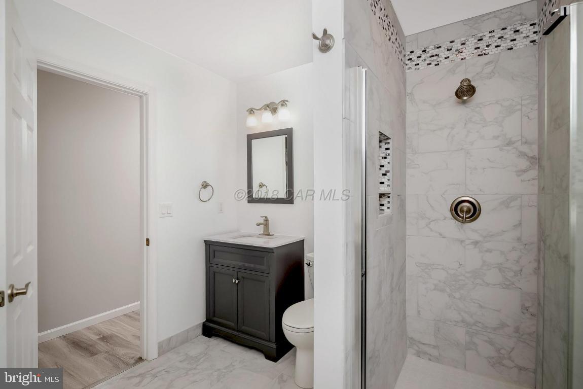 45 Abbyshire Road Ocean Pines, MD 21811 - Photo 21 of 37 a bathroom with a sink and mirror