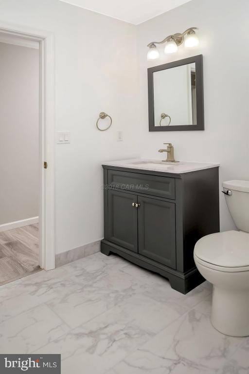 45 Abbyshire Road Ocean Pines, MD 21811 - Photo 22 of 37 a bathroom with a toilet sink and mirror
