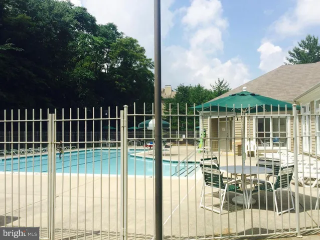 a view of a balcony with lake view and a floor to ceiling window
