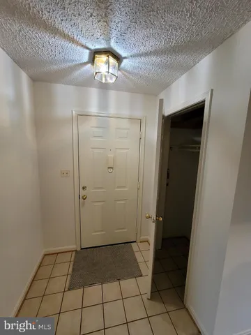a view of a house with pool and chairs