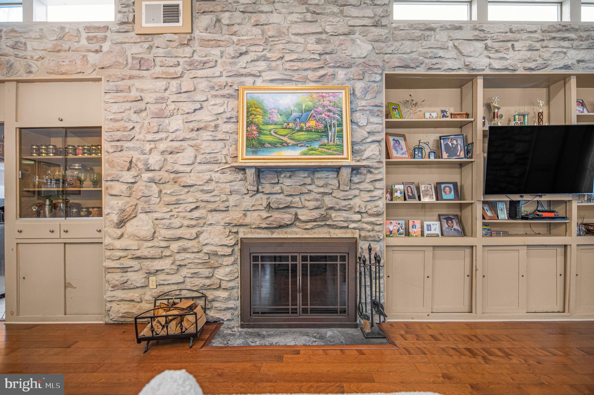 2409 Ashbourne Road Wyncote, PA 19095 - Photo 11 of 36 a living room with fireplace furniture and a flat screen tv