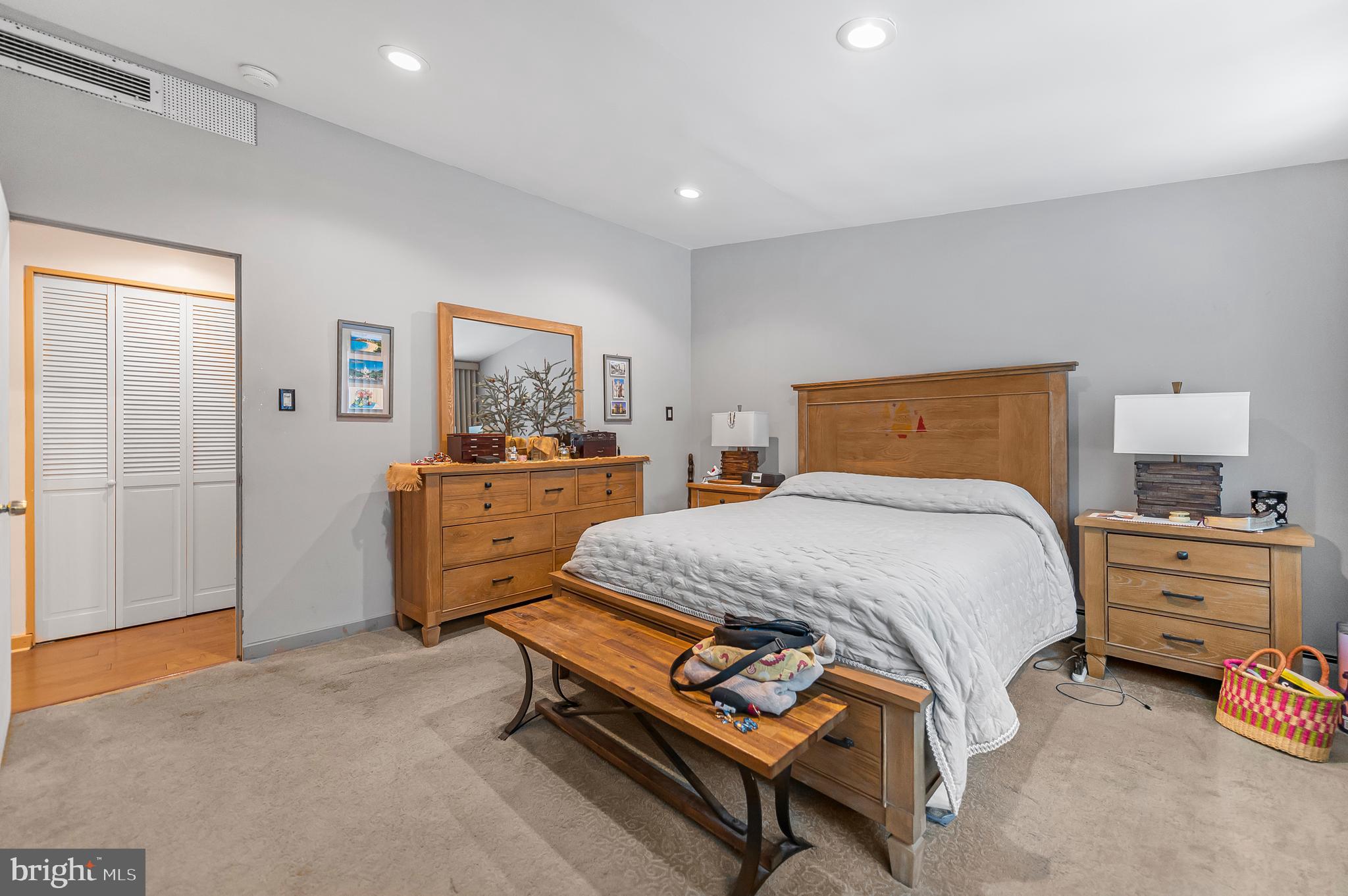 2409 Ashbourne Road Wyncote, PA 19095 - Photo 14 of 36 a bedroom with a bed and a dresser in it