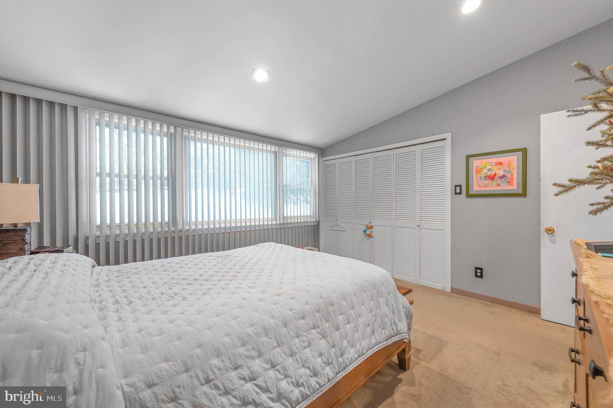 2409 Ashbourne Road Wyncote, PA 19095 - Photo 16 of 36 a bedroom with a bed and a window