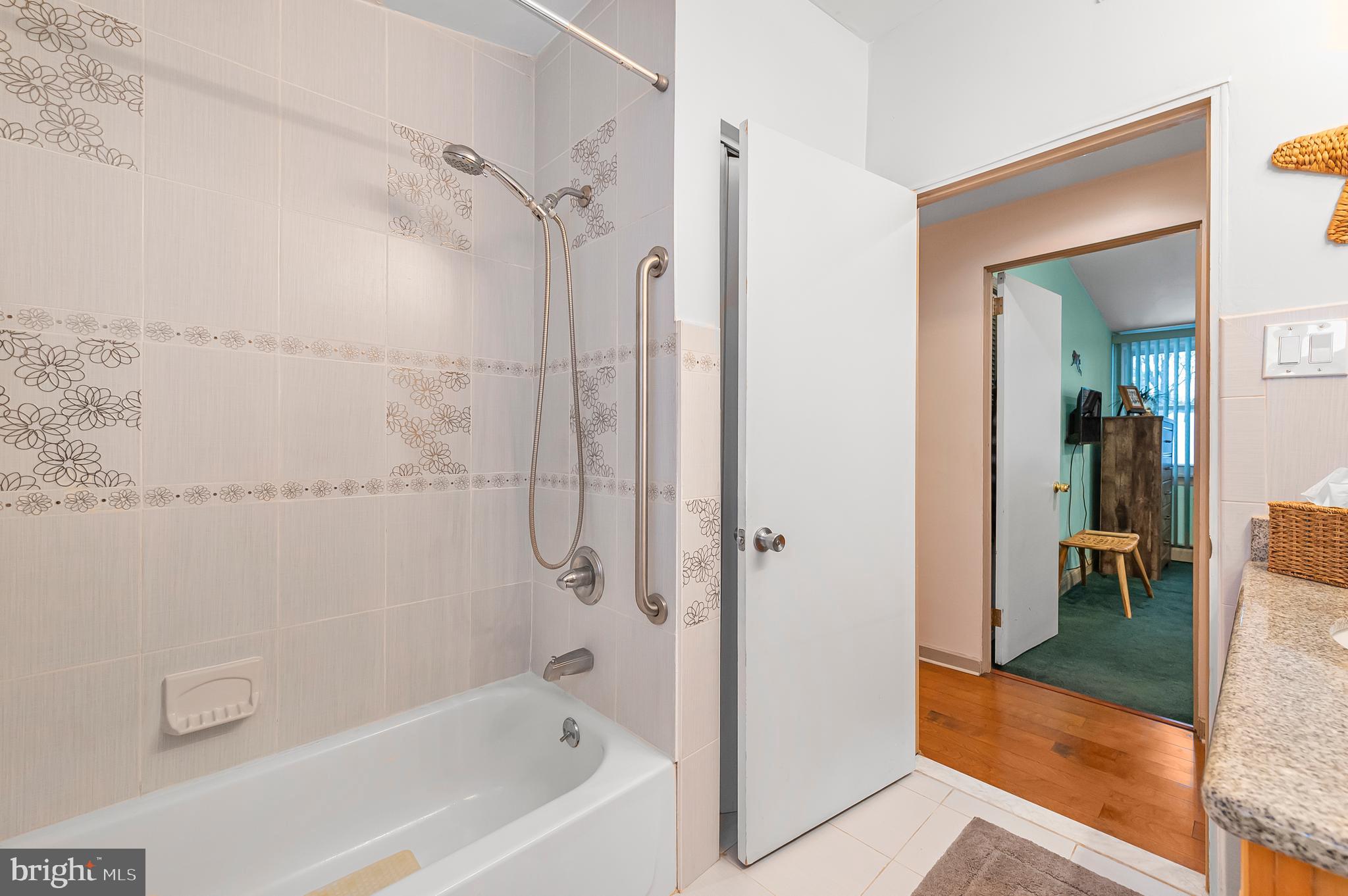 2409 Ashbourne Road Wyncote, PA 19095 - Photo 18 of 36 a bathroom with a bathtub and a shower