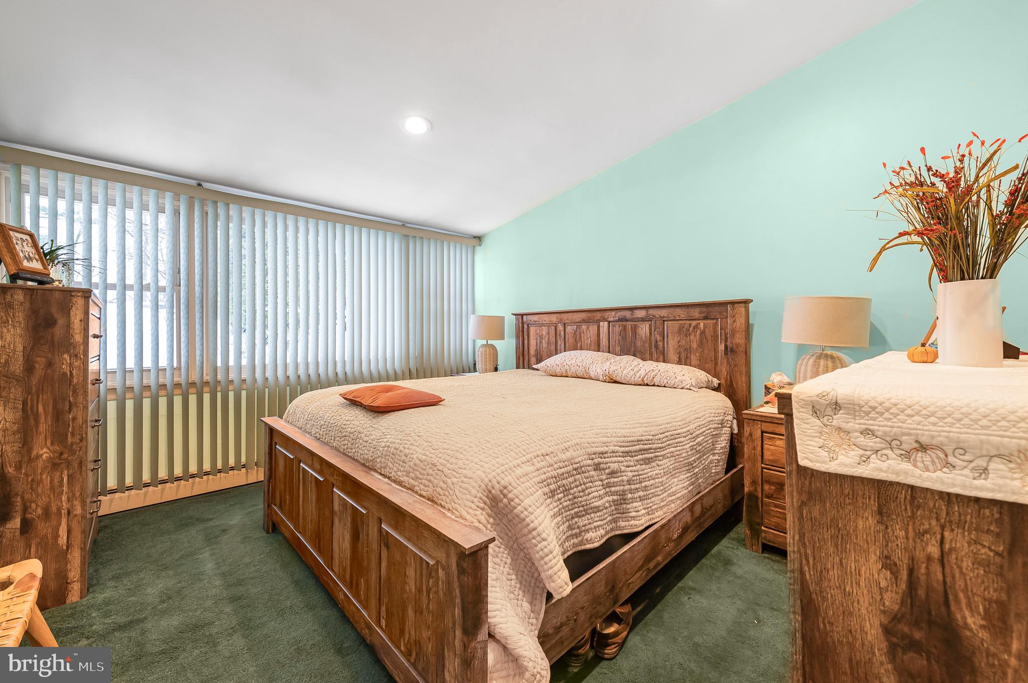 2409 Ashbourne Road Wyncote, PA 19095 - Photo 20 of 36 a bedroom with a bed and a potted plant