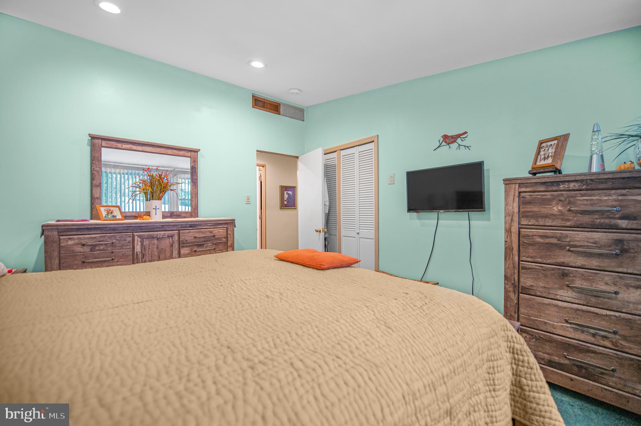2409 Ashbourne Road Wyncote, PA 19095 - Photo 21 of 36 a bedroom with a bed and a flat screen tv