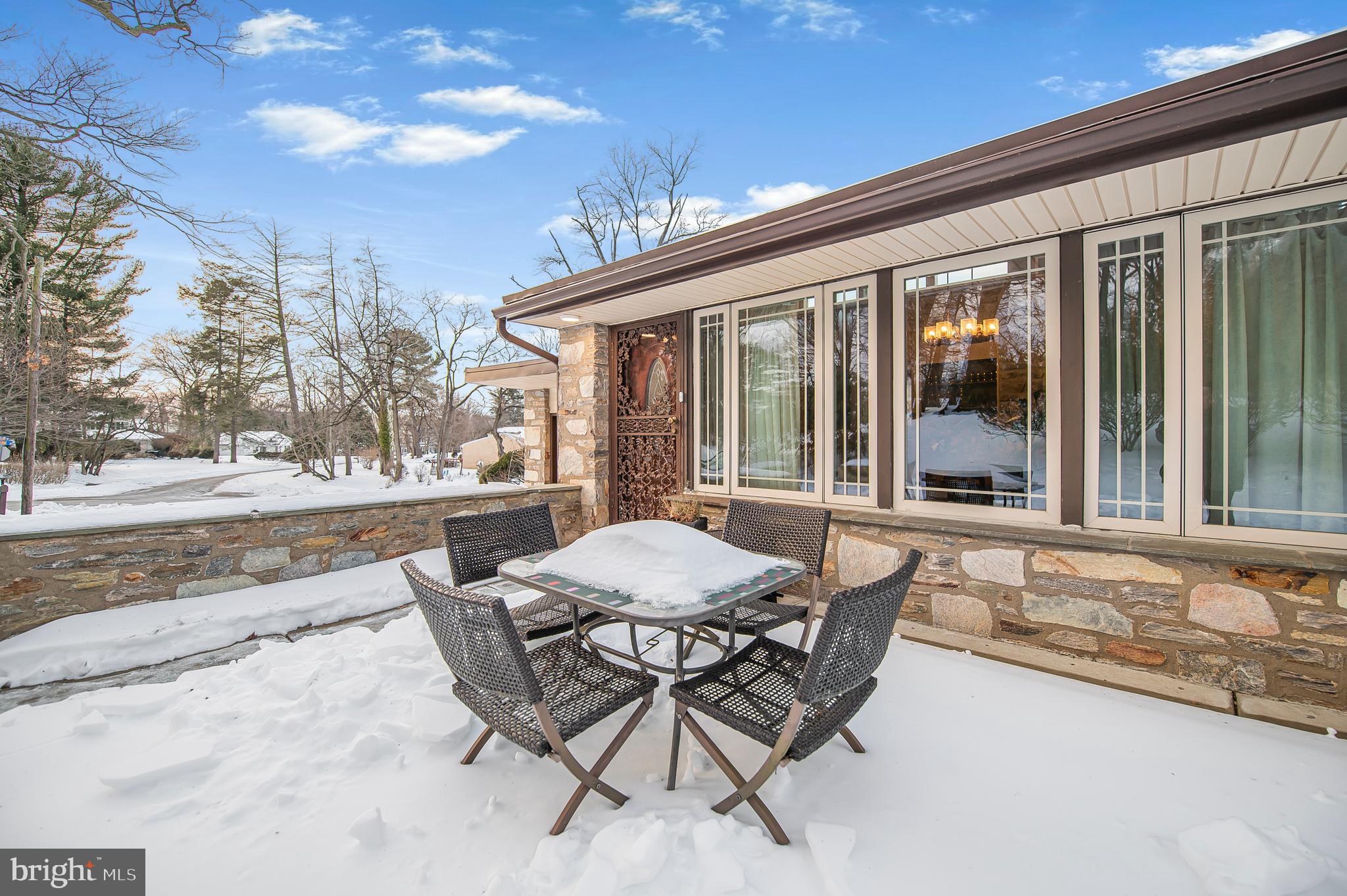 2409 Ashbourne Road Wyncote, PA 19095 - Photo 35 of 36 a patio with a table and chairs and potted plants