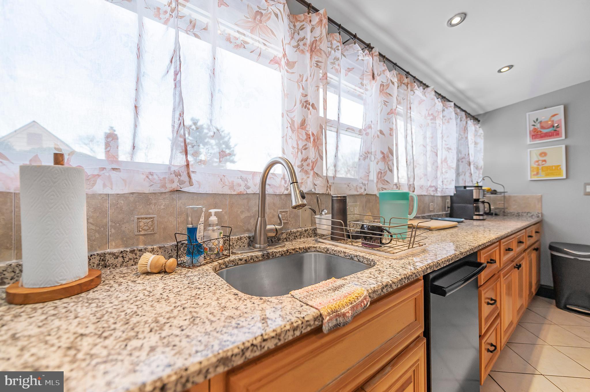 2409 Ashbourne Road Wyncote, PA 19095 - Photo 5 of 36 a kitchen with a sink and a large window