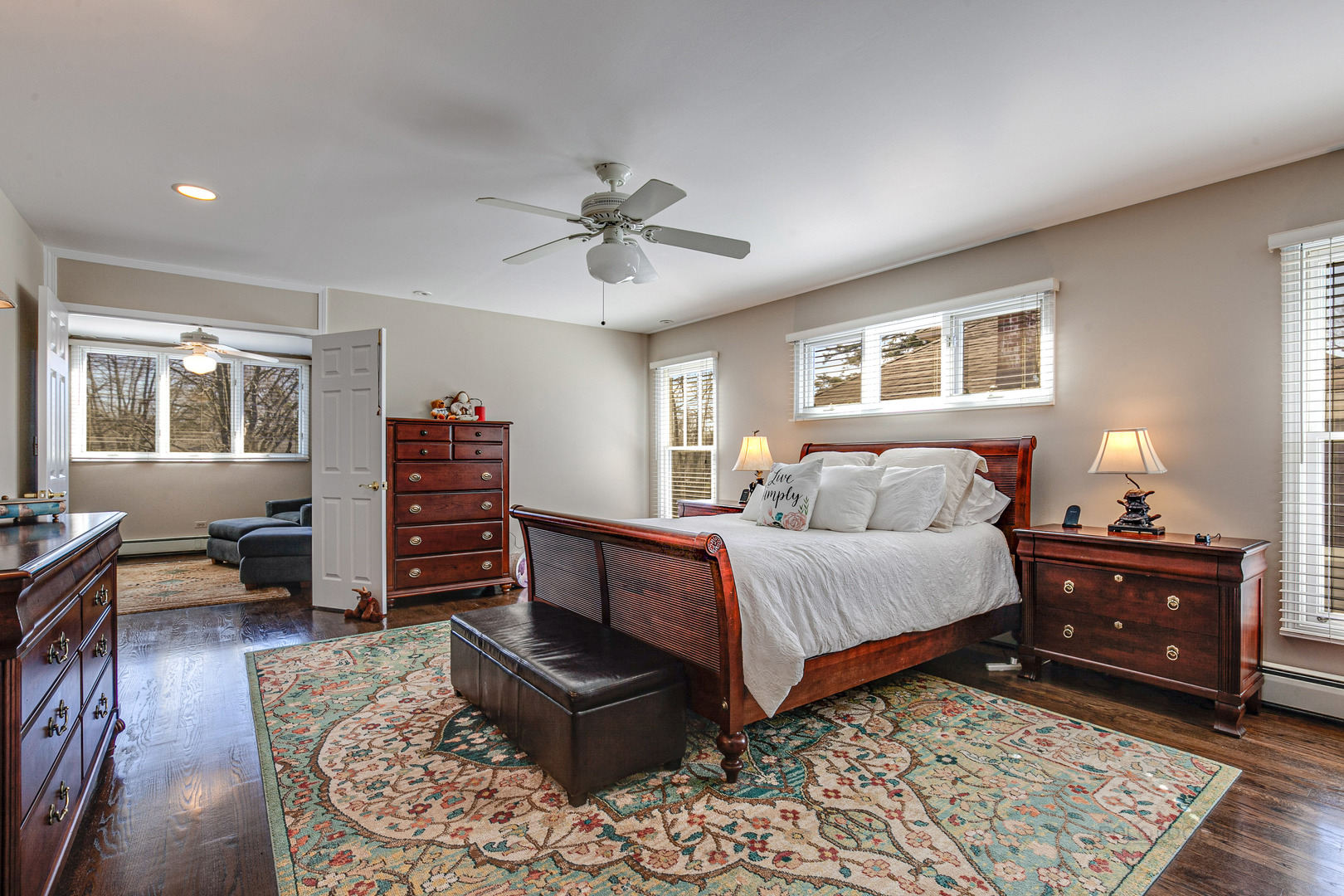 1050 Springfield Avenue Deerfield, IL 60015 - Photo 11 of 20 a spacious bedroom with a bed a dresser and wooden floor