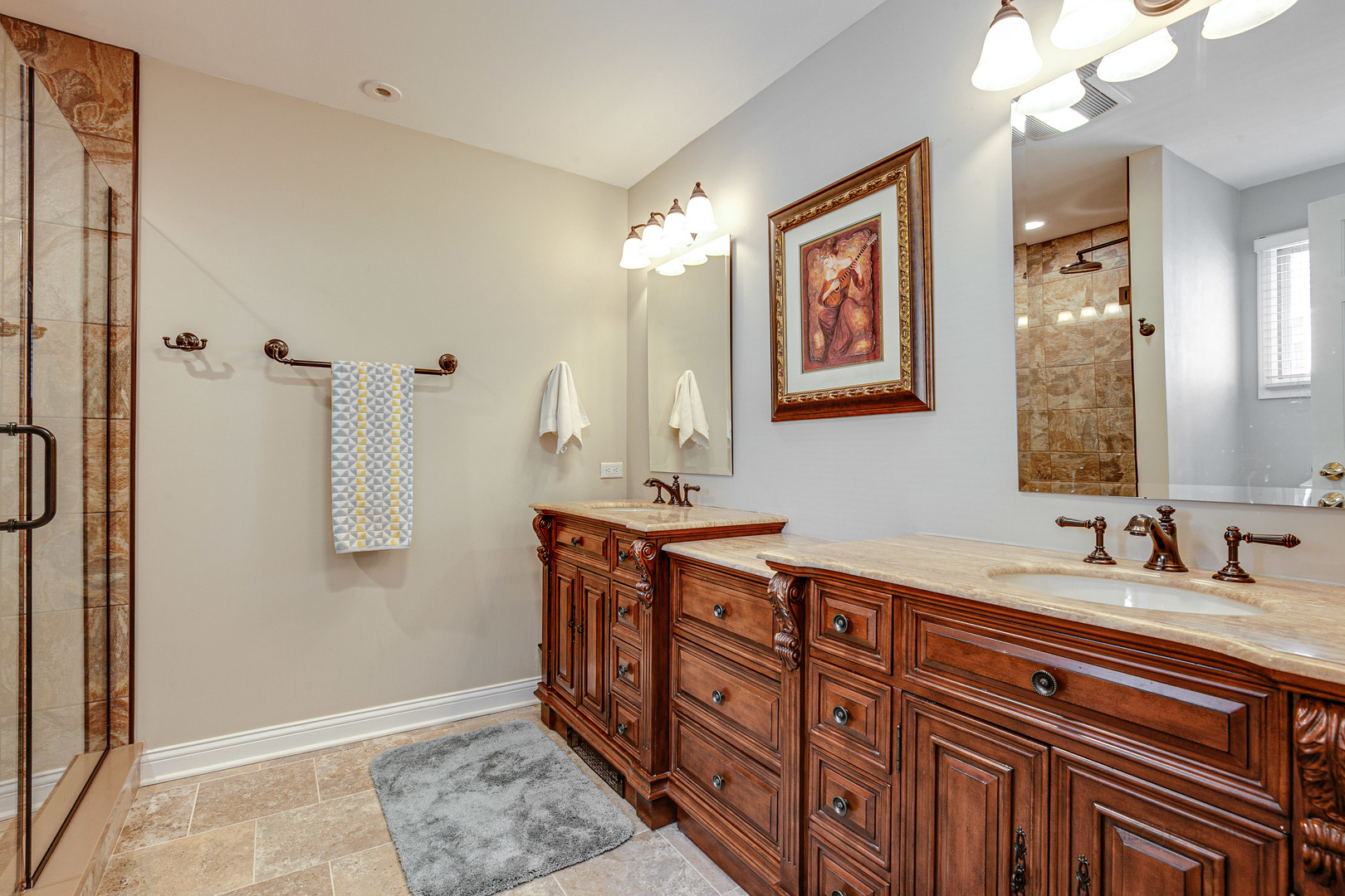 1050 Springfield Avenue Deerfield, IL 60015 - Photo 12 of 20 a spacious bathroom with a double vanity sink a large mirror and shower