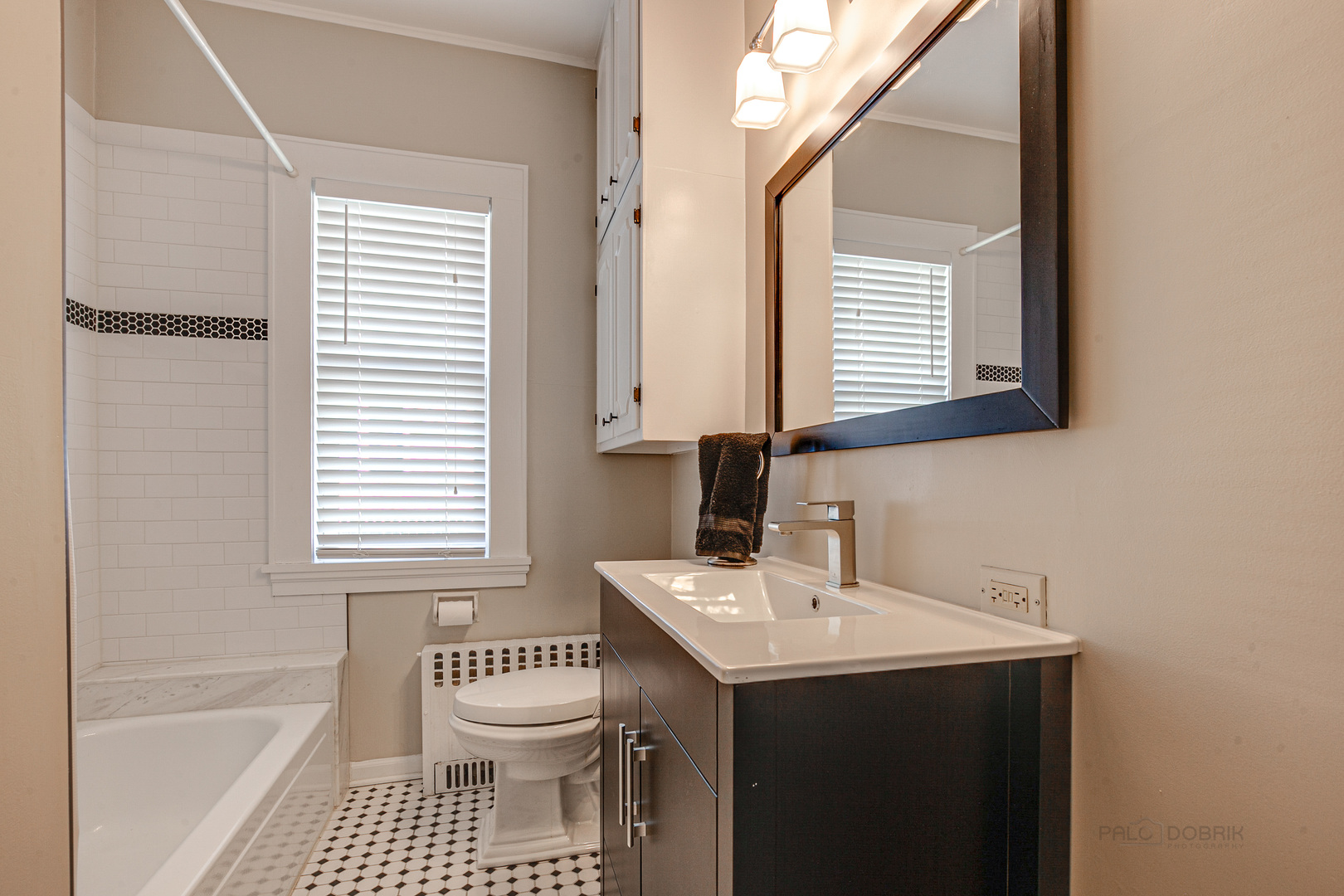 1050 Springfield Avenue Deerfield, IL 60015 - Photo 16 of 20 a bathroom with a sink a toilet and a bathtub