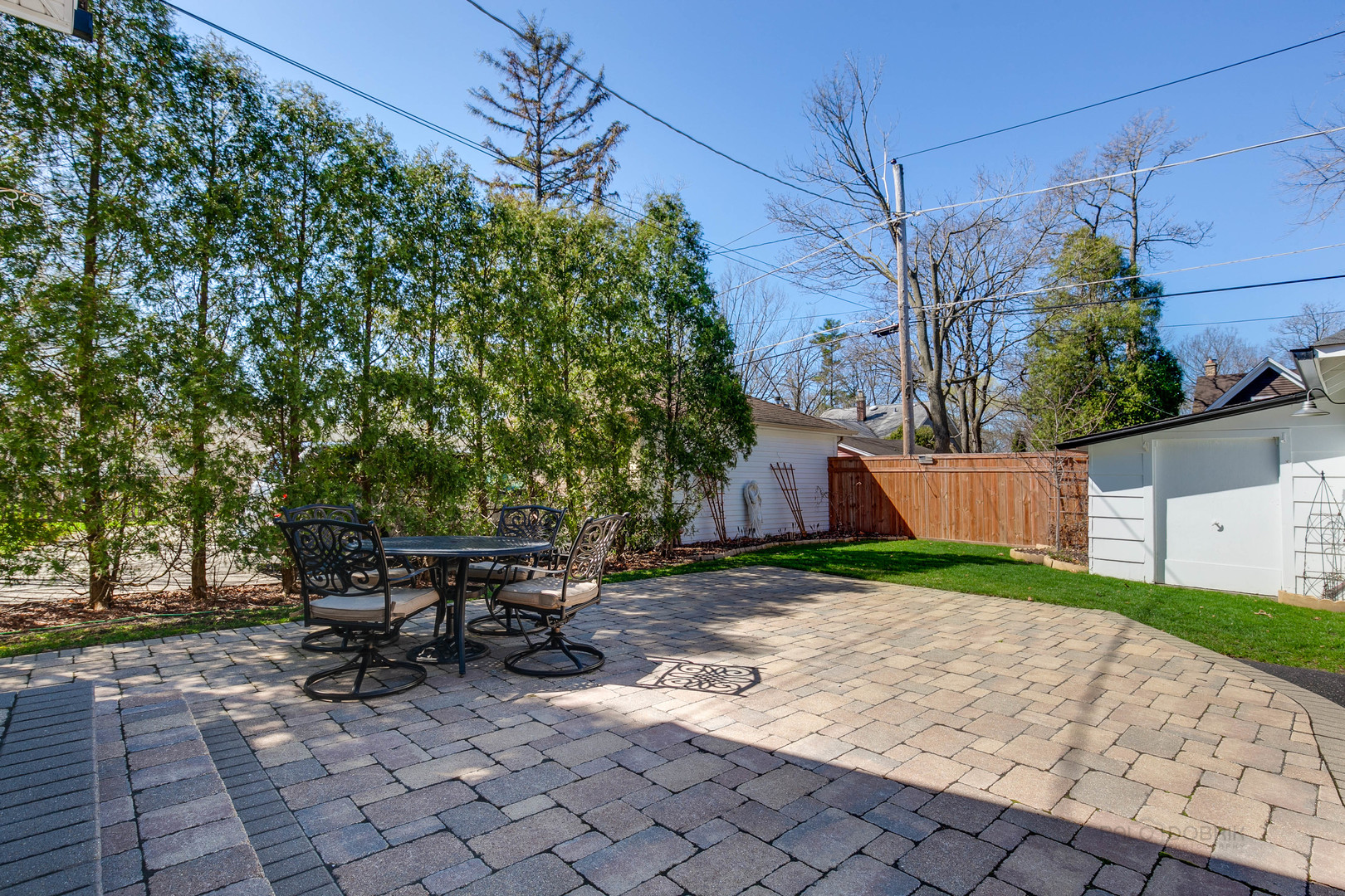 1050 Springfield Avenue Deerfield, IL 60015 - Photo 18 of 20 a view of backyard with table and chairs and potted plants