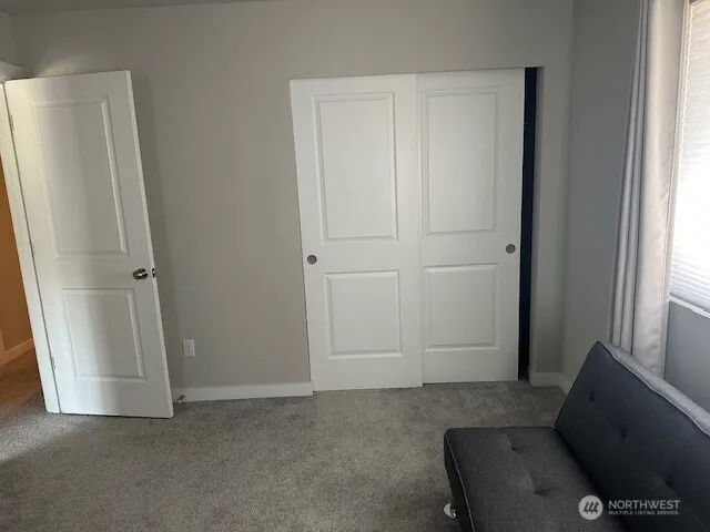 a view of room with window and hardwood
