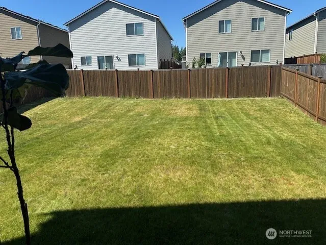 a view of front of house with a yard