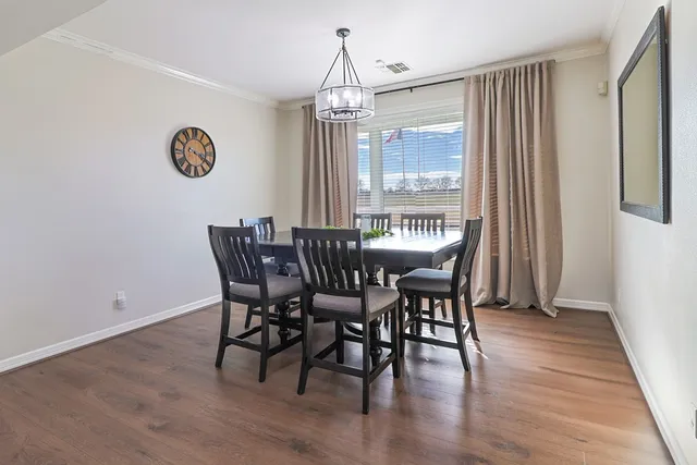 a spacious bathroom with a double vanity sink mirror and toilet