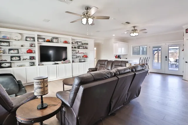a view of a house with swimming pool and sitting area