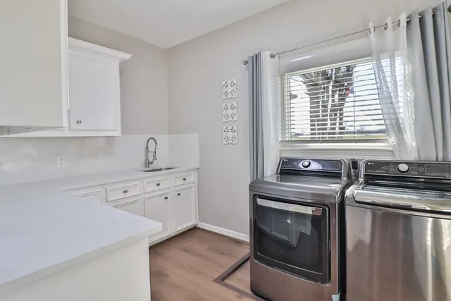 a view of a chairs and tables in the back yard of the house