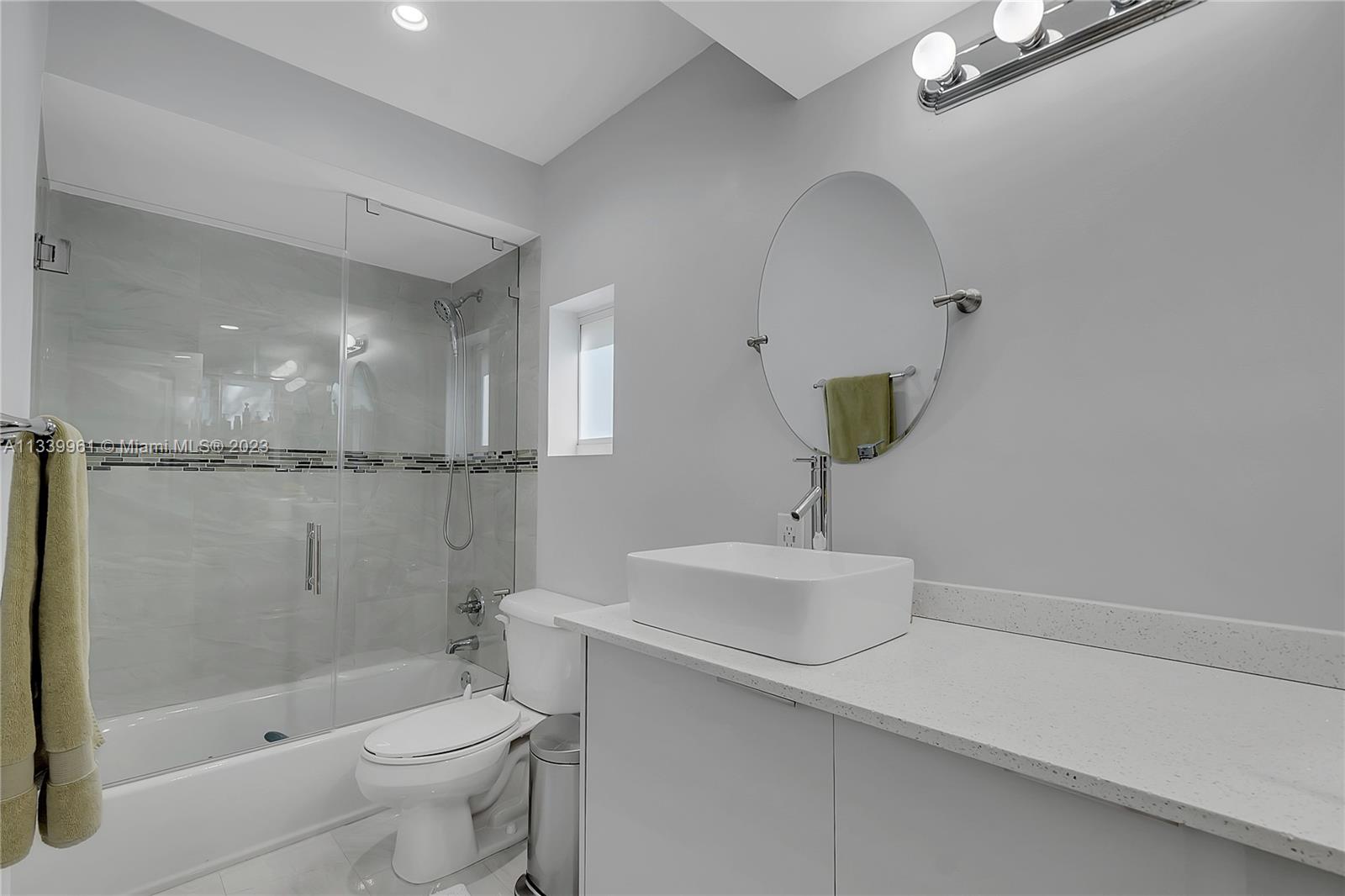 4033 South Le Jeune Road Miami, FL 33146 - Photo 13 of 24 a bathroom with a sink a toilet and shower